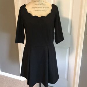 Scalloped neck black dress